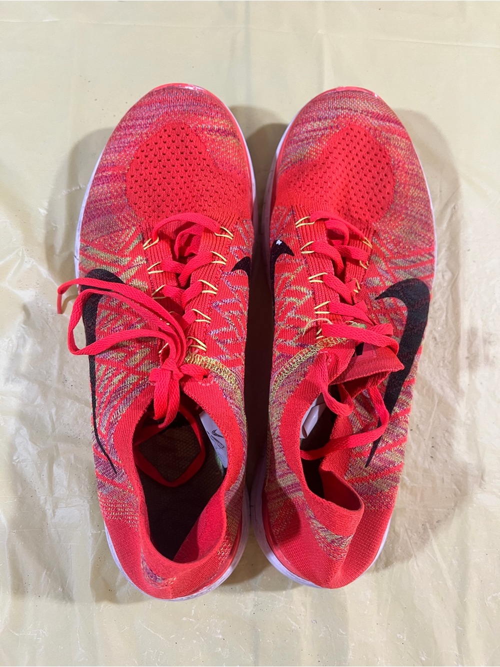 Nike Red Knit Athletic Running Shoes with Black Swoosh and Gold Accents